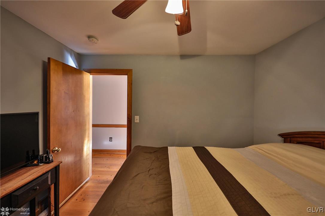 526 West Moorestown Road Nazareth, PA 18064 - Photo 18 of 50 a bedroom with a bed and a flat screen tv