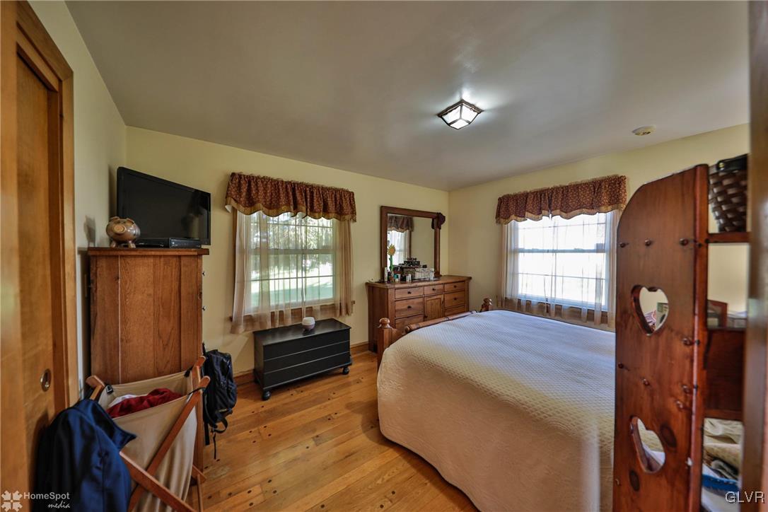 526 West Moorestown Road Nazareth, PA 18064 - Photo 19 of 50 a bedroom with a bed and a flat tv screen
