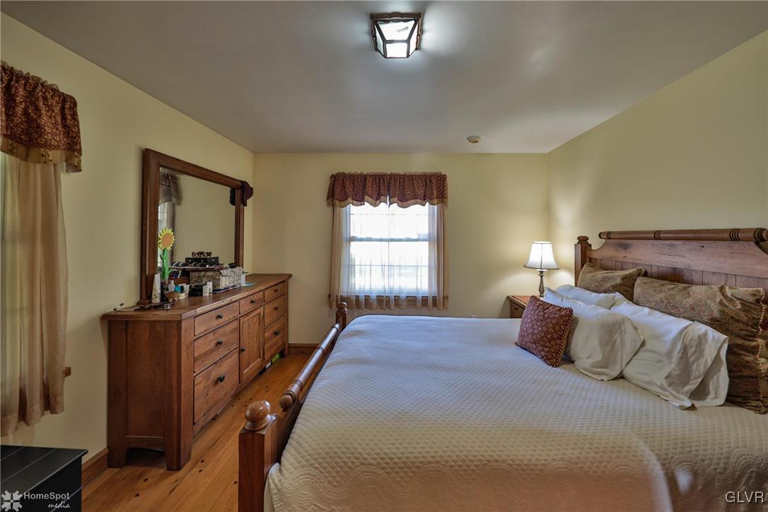 526 West Moorestown Road Nazareth, PA 18064 - Photo 20 of 50 a bedroom with a bed and a mirror on dresser