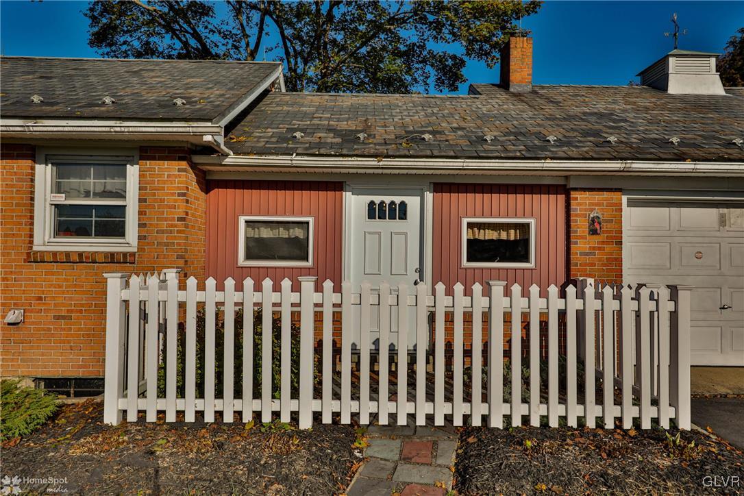 526 West Moorestown Road Nazareth, PA 18064 - Photo 2 of 50 a view of a brick house with a small yard