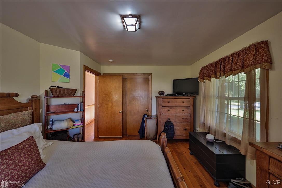 526 West Moorestown Road Nazareth, PA 18064 - Photo 21 of 50 a bedroom with furniture and a flat screen tv