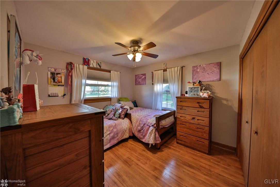 526 West Moorestown Road Nazareth, PA 18064 - Photo 25 of 50 a bedroom with a bed and a chandelier