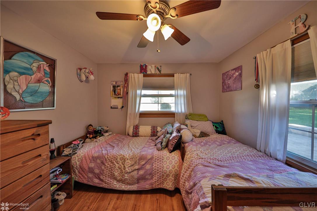 526 West Moorestown Road Nazareth, PA 18064 - Photo 26 of 50 a bedroom with a bed and a chandelier