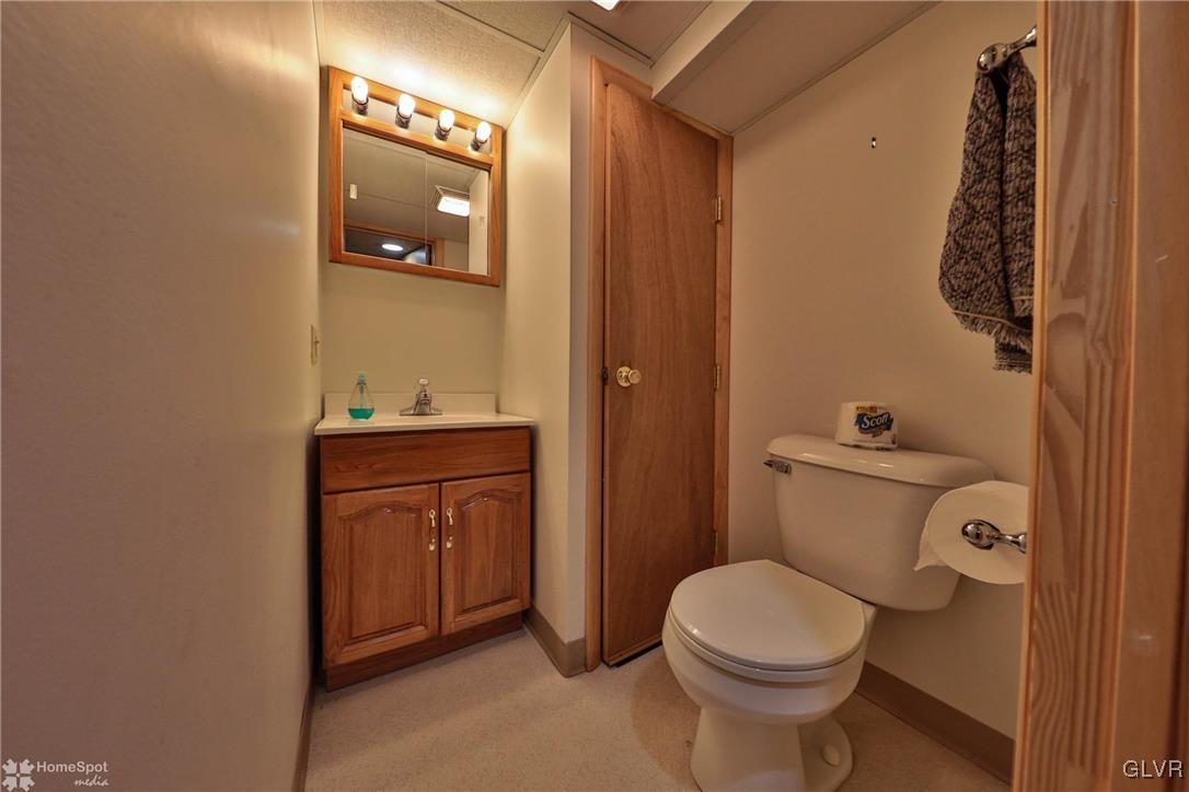 526 West Moorestown Road Nazareth, PA 18064 - Photo 31 of 50 a bathroom with a toilet a sink a vanity and mirror