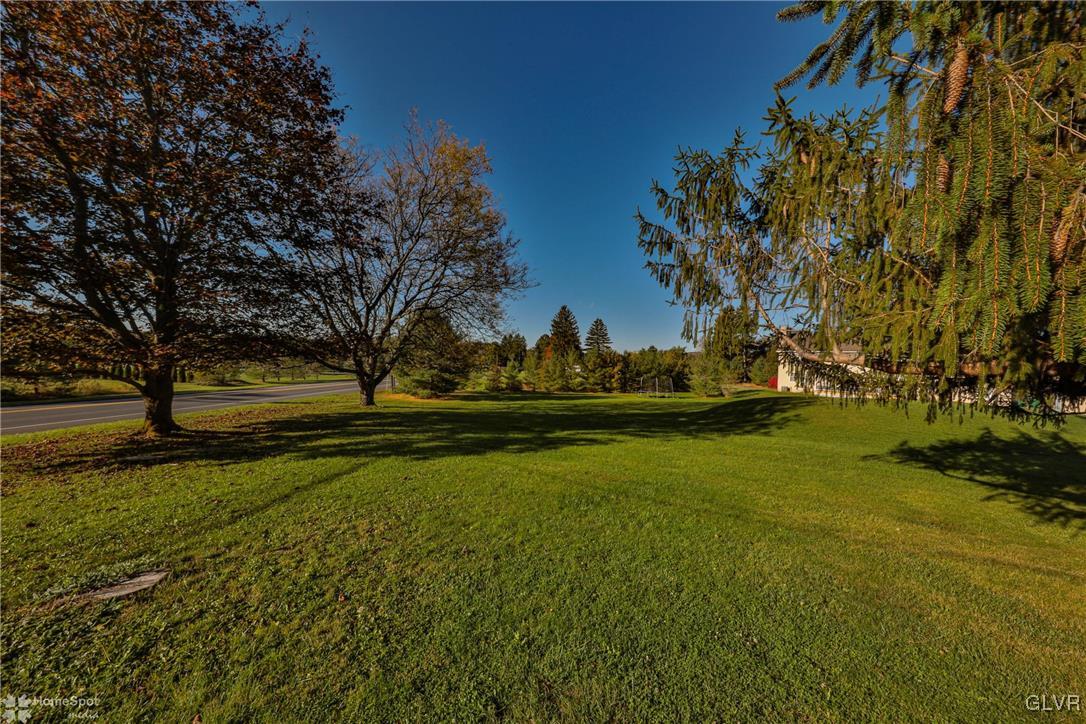526 West Moorestown Road Nazareth, PA 18064 - Photo 46 of 50 a view of a golf course with a lake