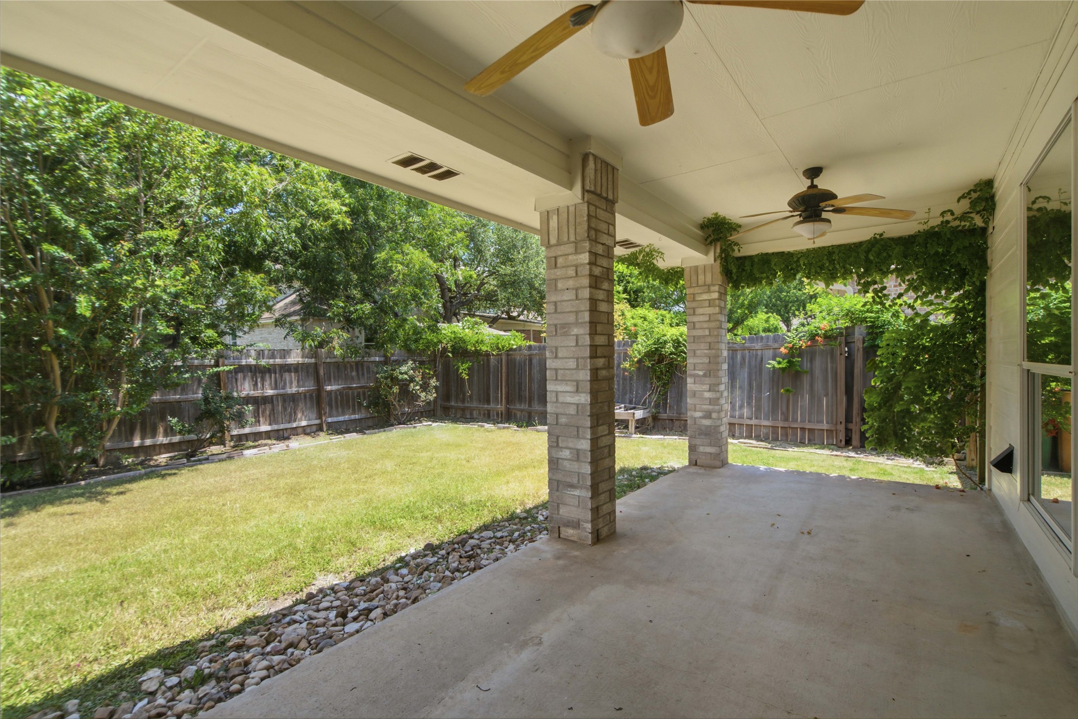 2920 Warwick Way Austin, TX 78748 - Photo 31 of 36 An inviting covered patio opens to a grassy, fenced backyard perfect for relaxation