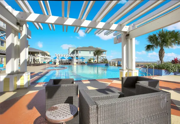 a view of swimming pool with outdoor seating