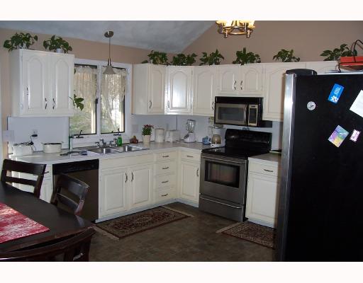 15 Melrose Road Bristol, RI 02809 - Photo 2 of 8 Kitchen. Newer kitchen appliances, nice open layout, walk out to a deck. seasonal waterviews.