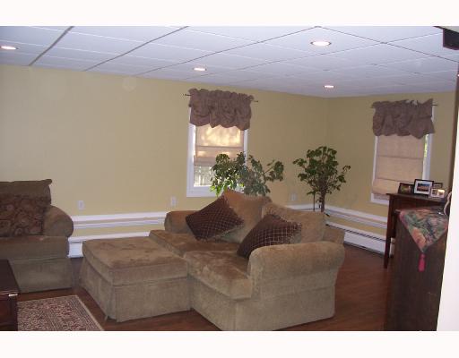 15 Melrose Road Bristol, RI 02809 - Photo 6 of 8 Den/Family/Great Room. Nice bright open family room