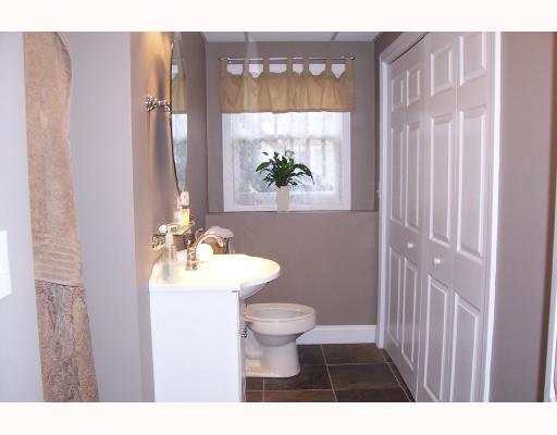15 Melrose Road Bristol, RI 02809 - Photo 7 of 8 Other. Lower level bath has all new fixtures and laundry hidden behind folding 6 panel doors.