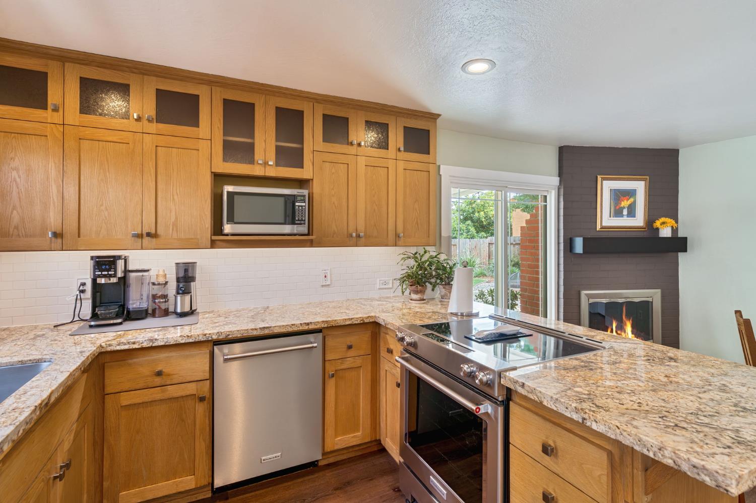 5422 Earnell Street Carmichael, CA 95608 - Photo 16 of 39 a kitchen with granite countertop a sink stove and cabinets
