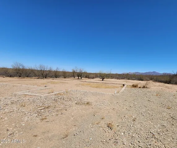 a view of a yard covered with snow in the yard