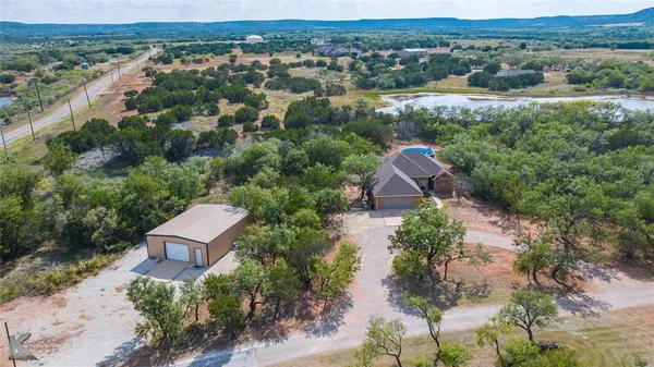 an aerial view of house with yard