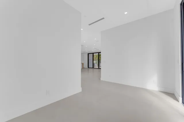a kitchen with granite countertop cabinets and refrigerator