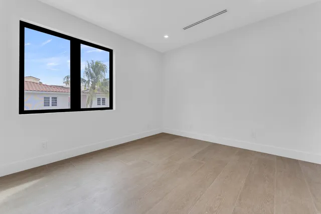 a view of an empty room with a balcony