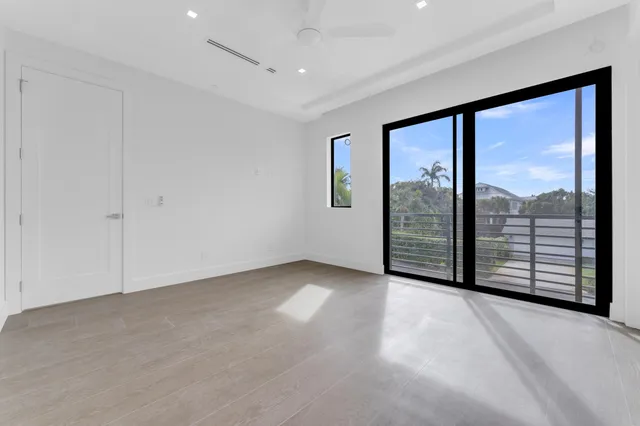 an aerial view of a city with lots of residential buildings lake and ocean view
