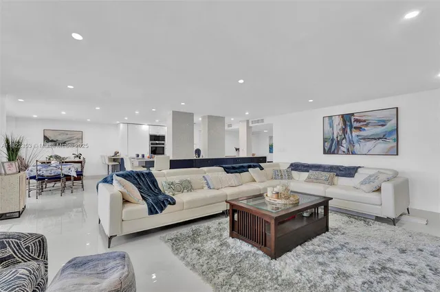 a living room with furniture and view of living room