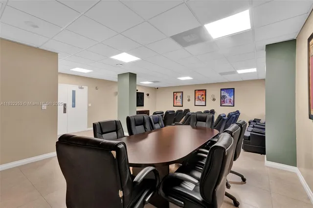 a room with lots of table and chairs