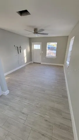 a view of empty room with windows