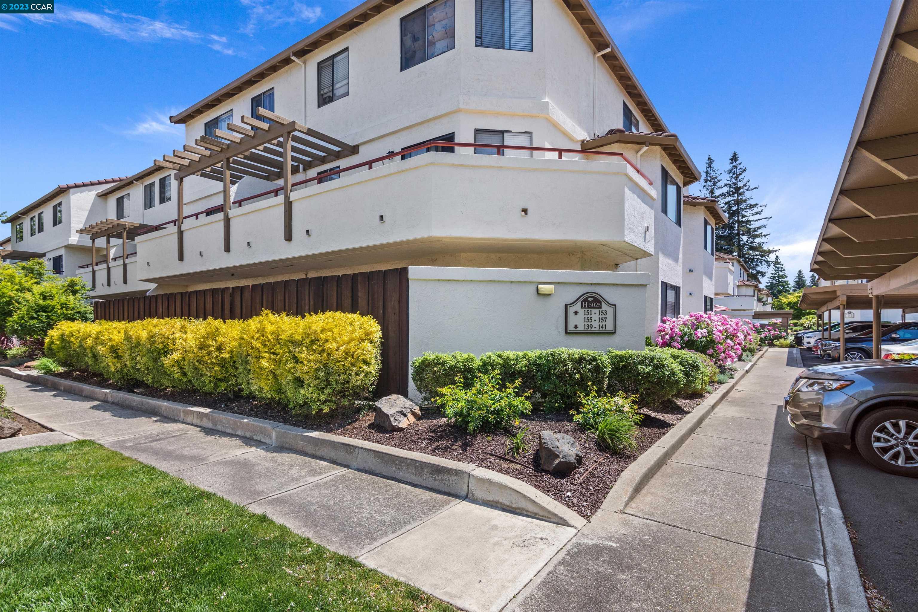 5025 Valley Crest Drive, Unit 151 Concord, CA 94521 - Photo 1 of 1 a front view of a house with garden