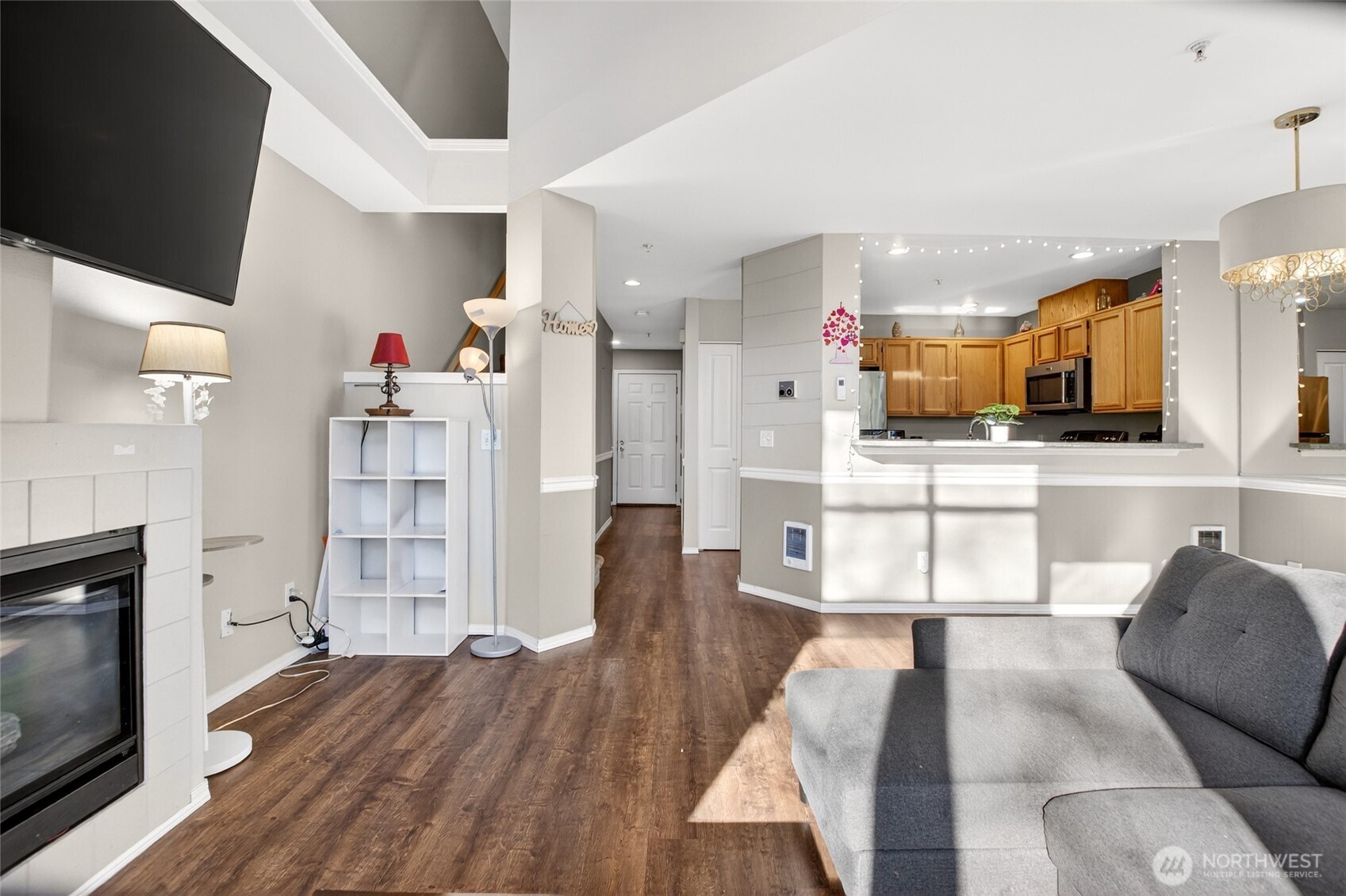 6615 South 239th Place, Unit R109 Kent, WA 98032 - Photo 11 of 40 a living room with furniture and a wooden floor