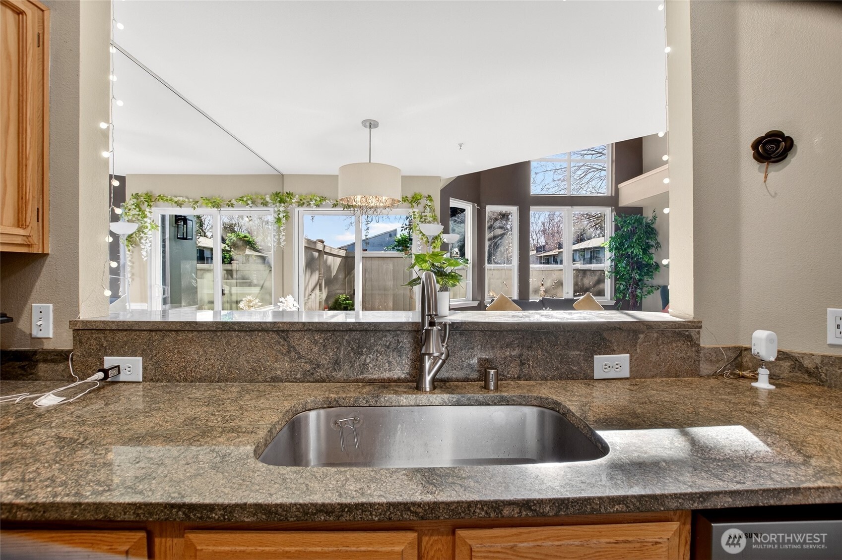 6615 South 239th Place, Unit R109 Kent, WA 98032 - Photo 17 of 40 a kitchen with granite countertop a sink and a granite counter tops