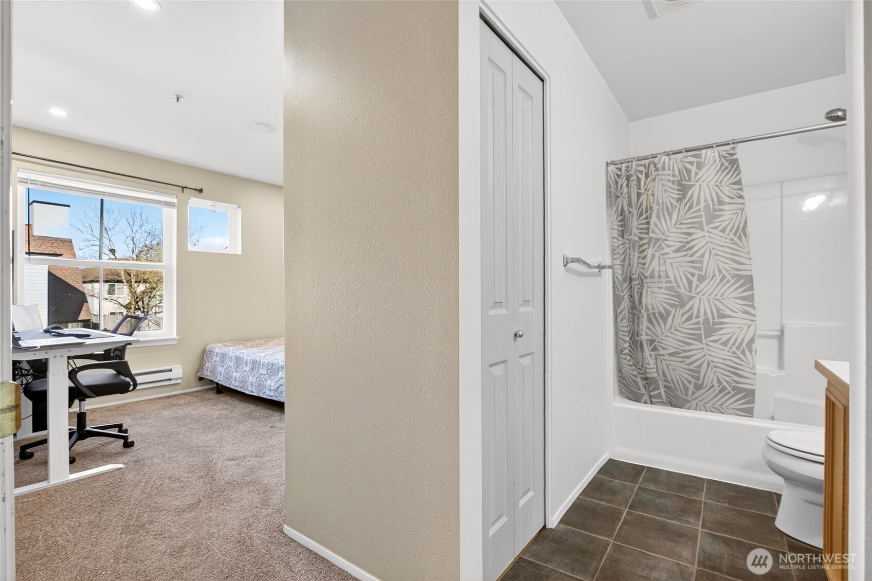 6615 South 239th Place, Unit R109 Kent, WA 98032 - Photo 28 of 40 a workspace with white wall and a chair