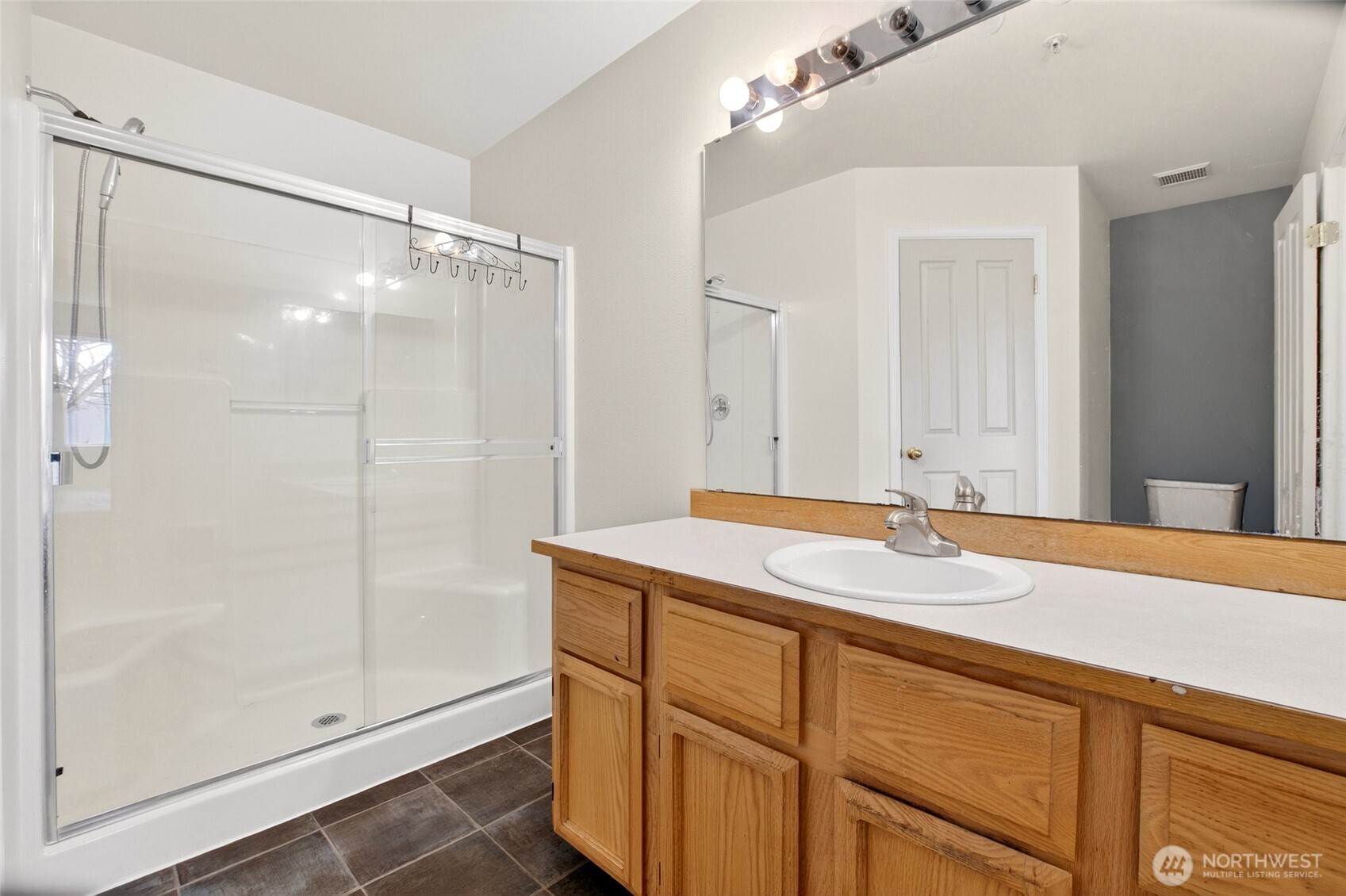 6615 South 239th Place, Unit R109 Kent, WA 98032 - Photo 34 of 40 a bathroom with a granite countertop sink mirror and double