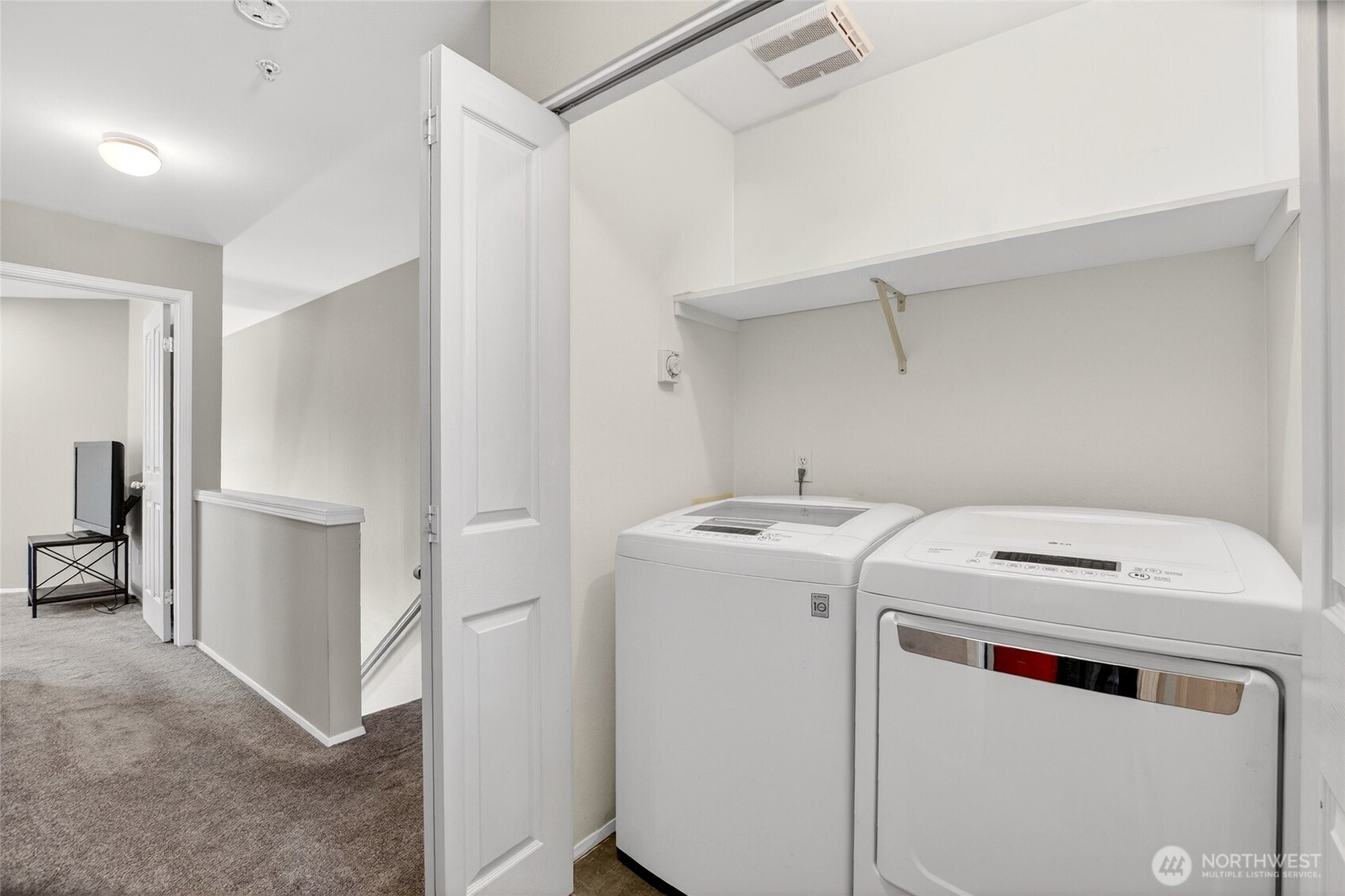 6615 South 239th Place, Unit R109 Kent, WA 98032 - Photo 35 of 40 a utility room with dryer and washer