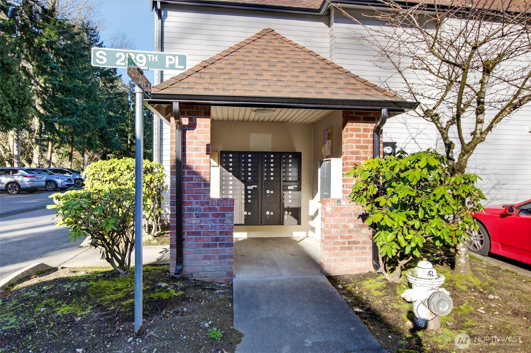6615 South 239th Place, Unit R109 Kent, WA 98032 - Photo 36 of 40 a front view of a house with a yard