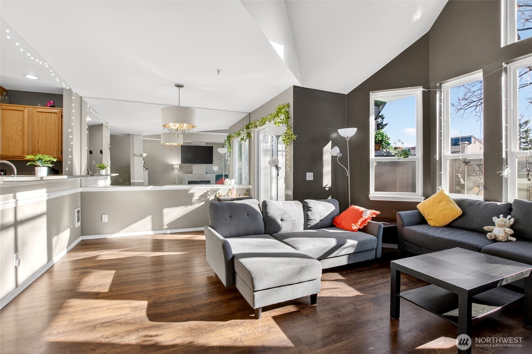 6615 South 239th Place, Unit R109 Kent, WA 98032 - Photo 10 of 40 a living room with furniture and a large window