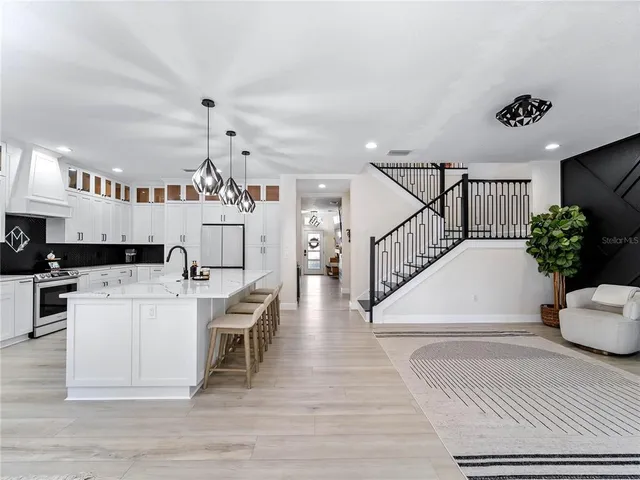 a view of a livingroom with furniture window and wooden floor