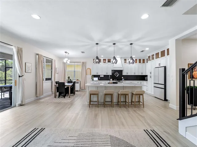 a bathroom with a toilet sink a mirror and vanity