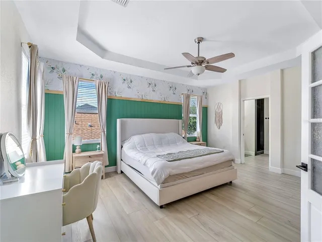 a view of a workspace with furniture and a bookshelf