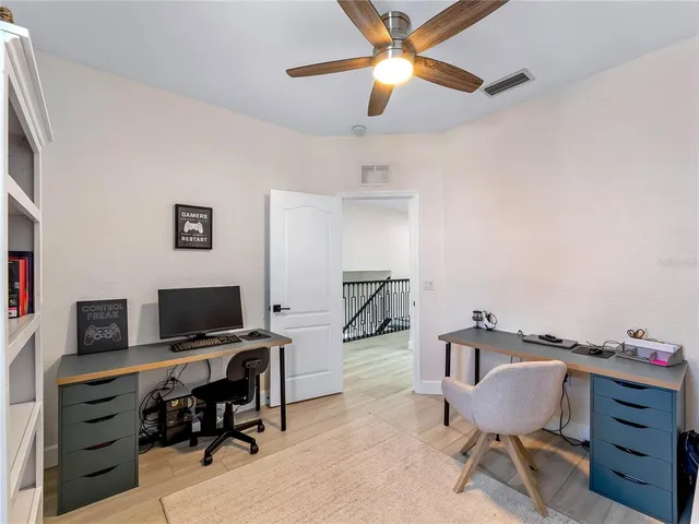 a view of a backyard with swimming pool