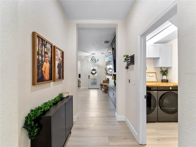a view of a kitchen with a sink and cabinets