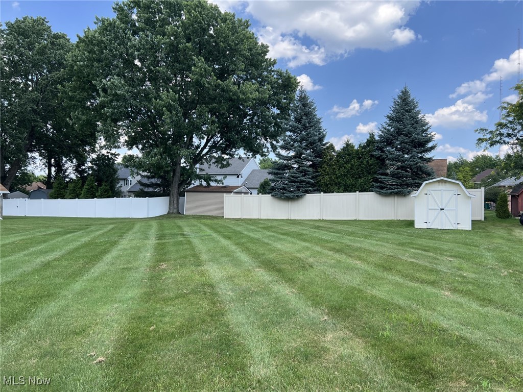 7579 McCreary Road Independence, OH 44131 - Photo 32 of 33 Fenced backyard featuring a shed