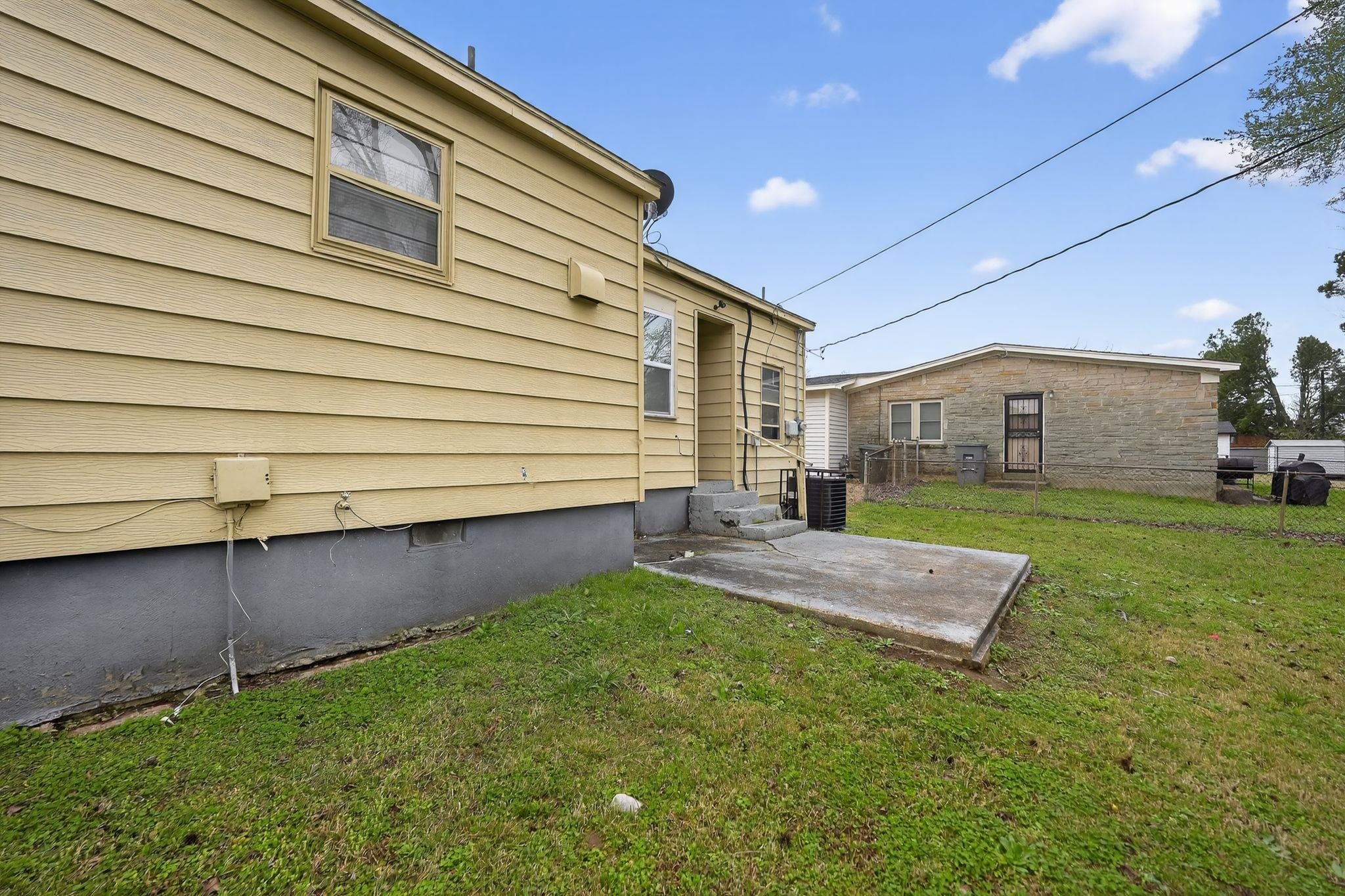 4553 Neely Road Memphis, TN 38109 - Photo 20 of 33 a view of house with backyard and porch
