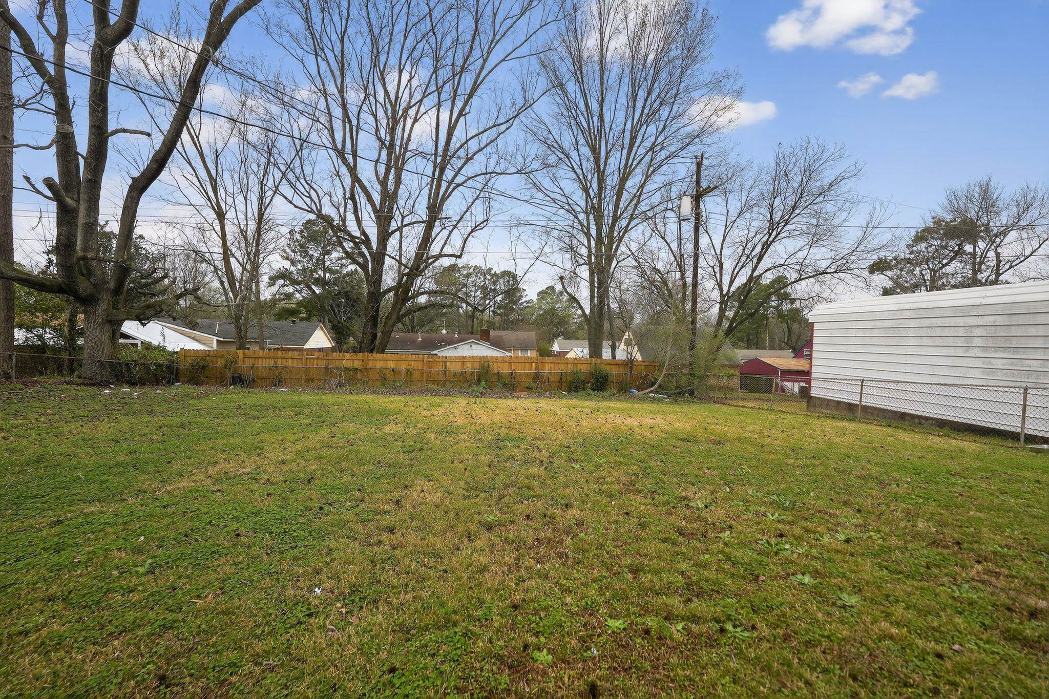 4553 Neely Road Memphis, TN 38109 - Photo 28 of 33 a view of outdoor space with deck and trees