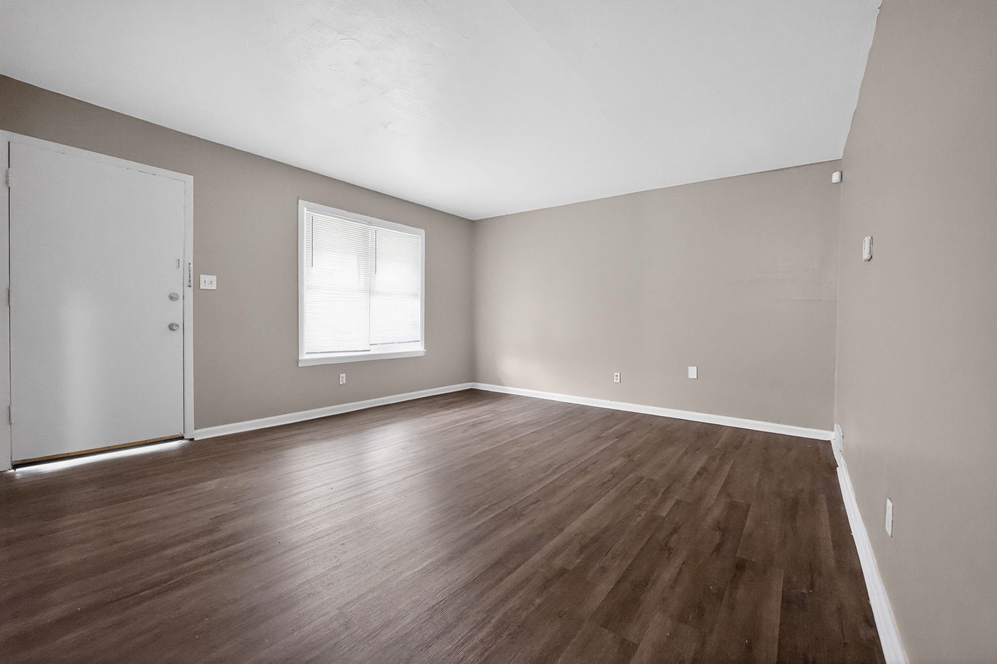 4553 Neely Road Memphis, TN 38109 - Photo 29 of 33 wooden floor in an empty room with a window
