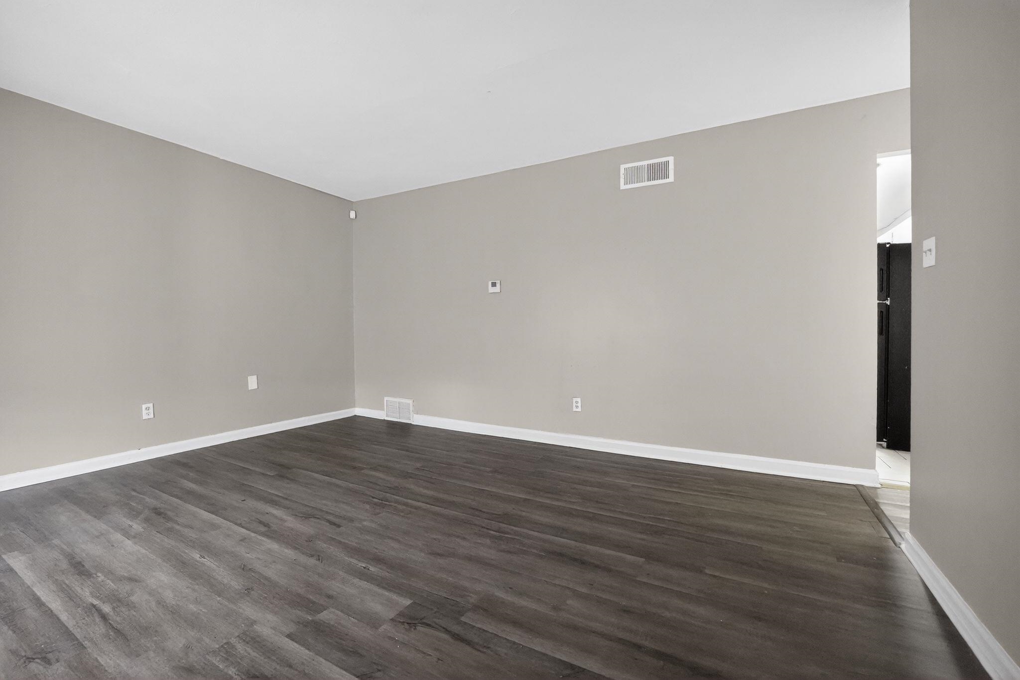 4553 Neely Road Memphis, TN 38109 - Photo 30 of 33 a view of an empty room with wooden floor