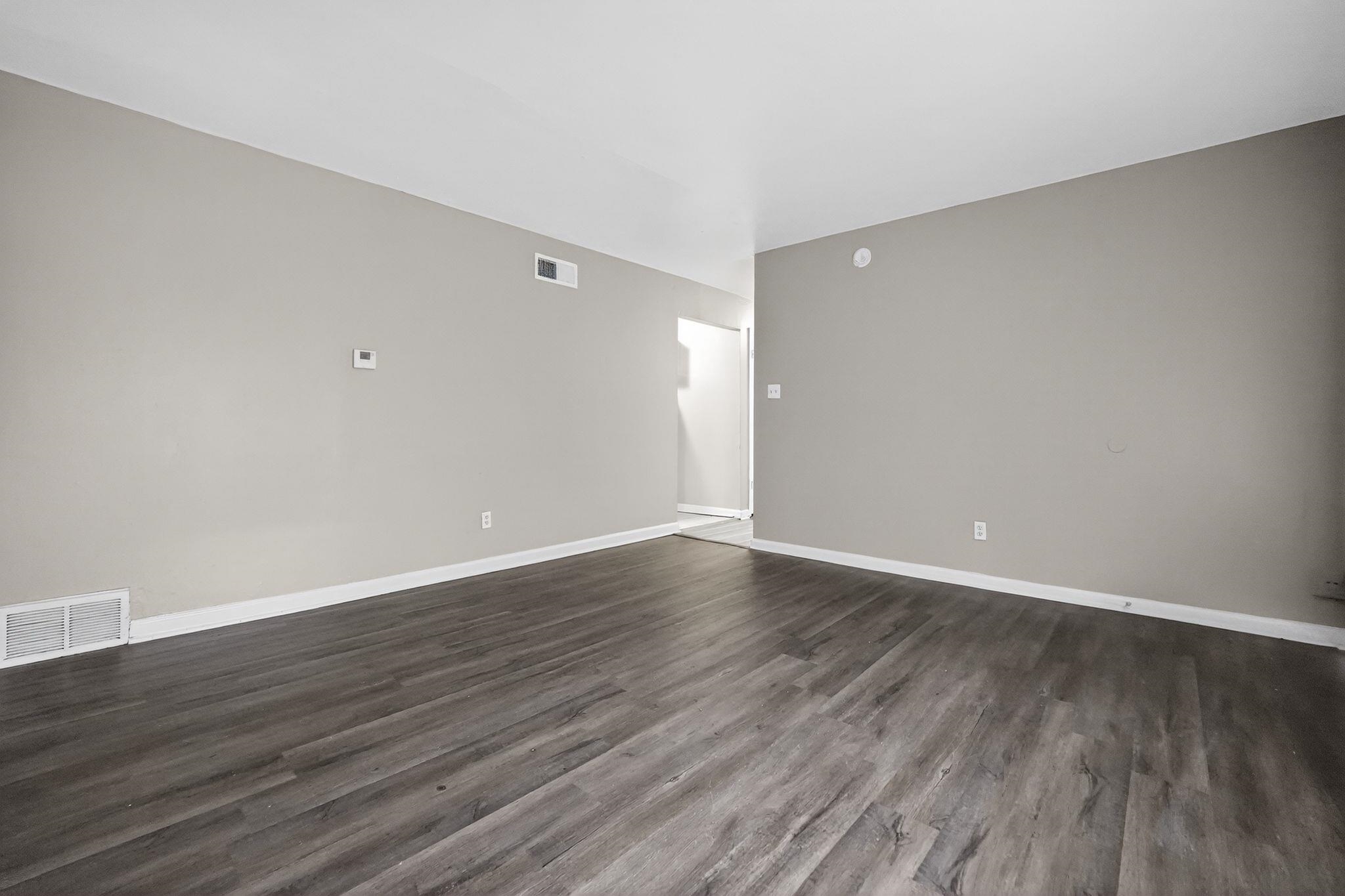 4553 Neely Road Memphis, TN 38109 - Photo 31 of 33 a view of an empty room with wooden floor