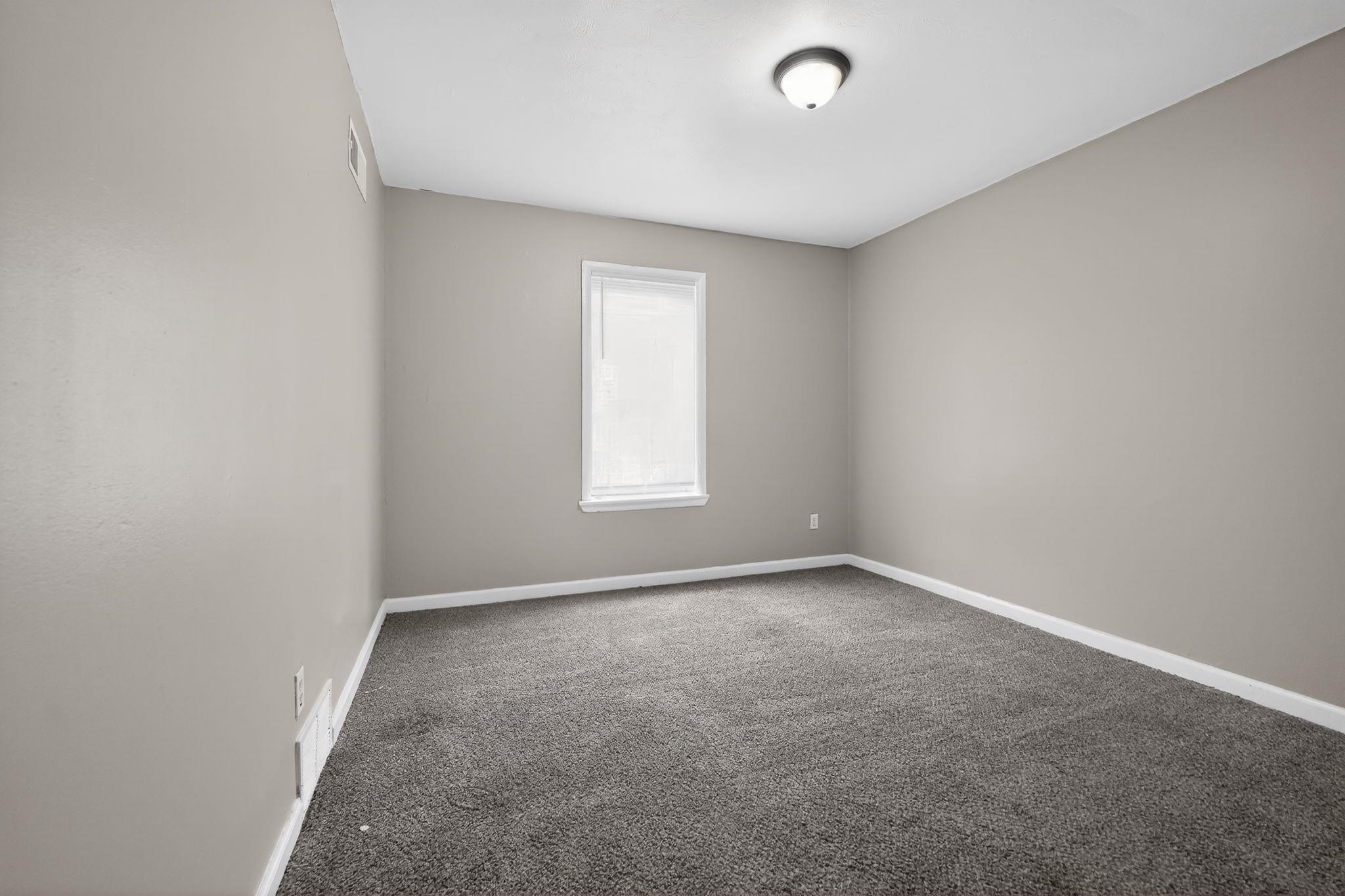 4553 Neely Road Memphis, TN 38109 - Photo 32 of 33 an empty room with a window