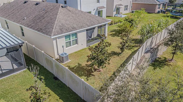 a aerial view of a house with a yard