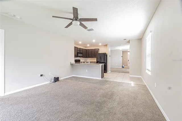 a view of a kitchen with a sink and a window