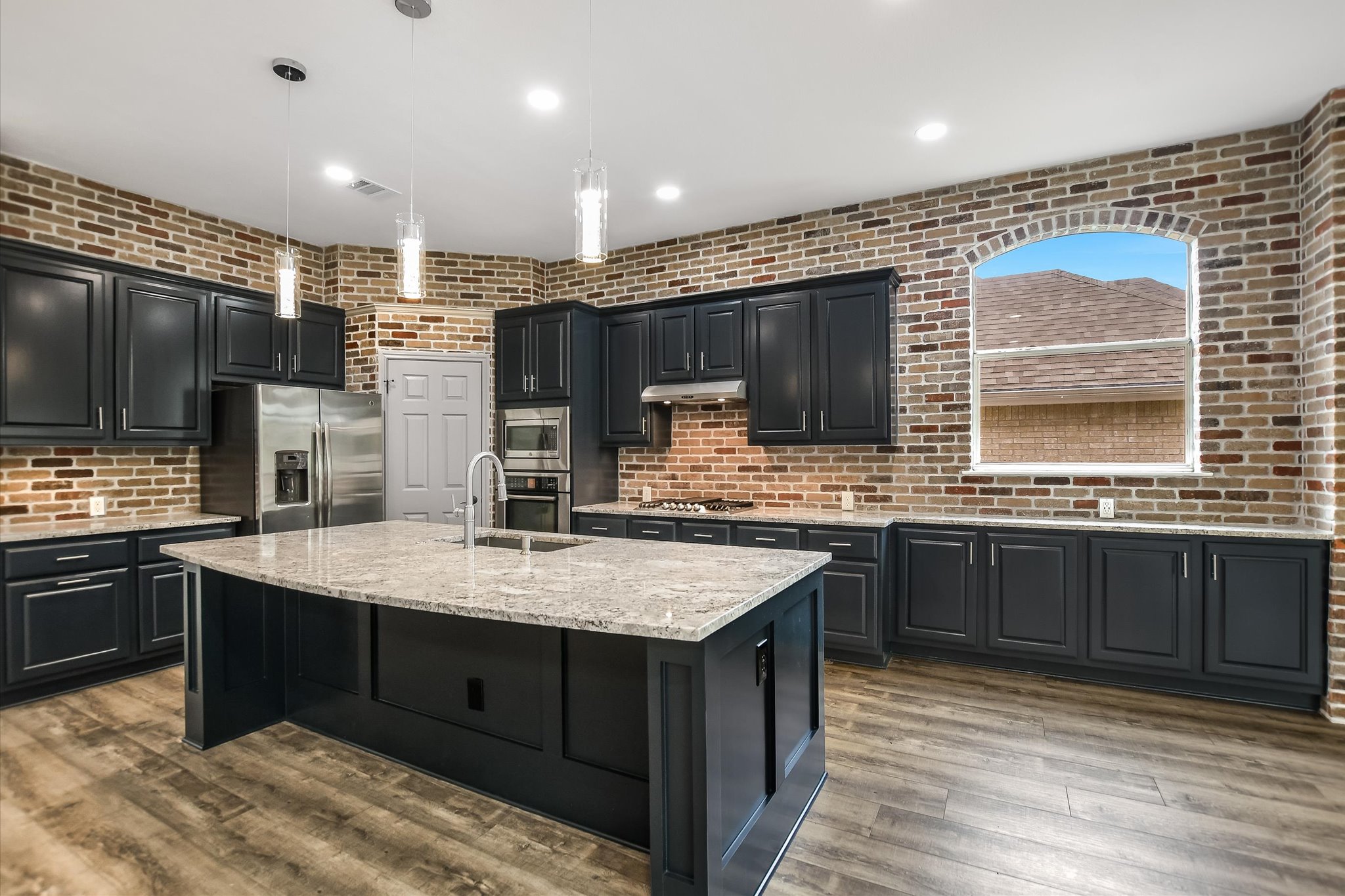 3517 Grimes Ranch Road Austin, TX 78732 - Photo 8 of 26 Remodeled Kitchen With Brick Accent