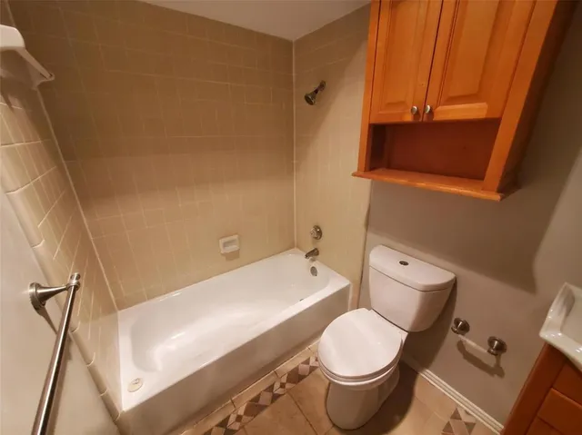 a bathroom with a toilet and a sink