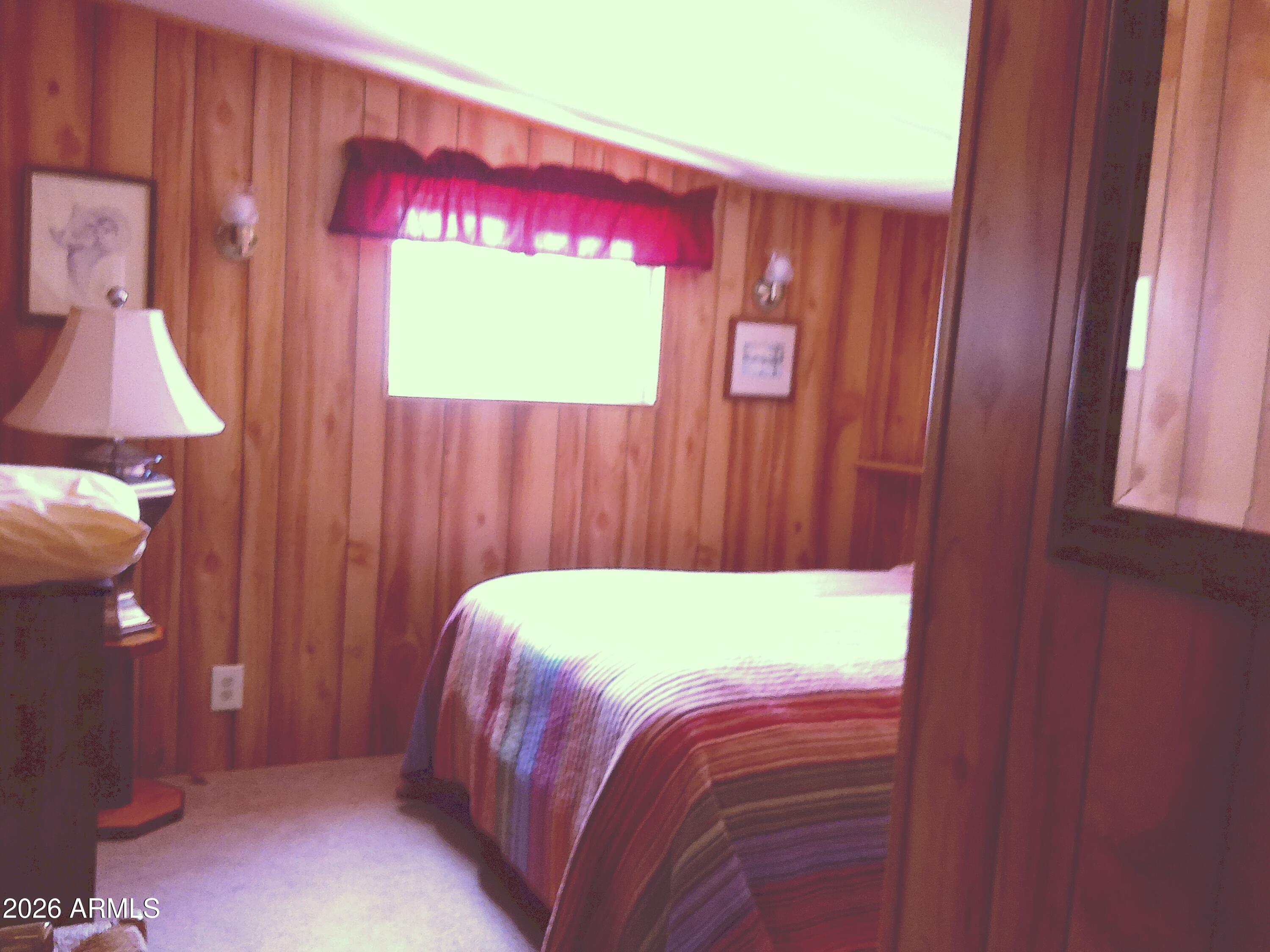 800 West Apache Trail, Unit 142 Apache Junction, AZ 85120 - Photo 28 of 33 a room with a bed and a window