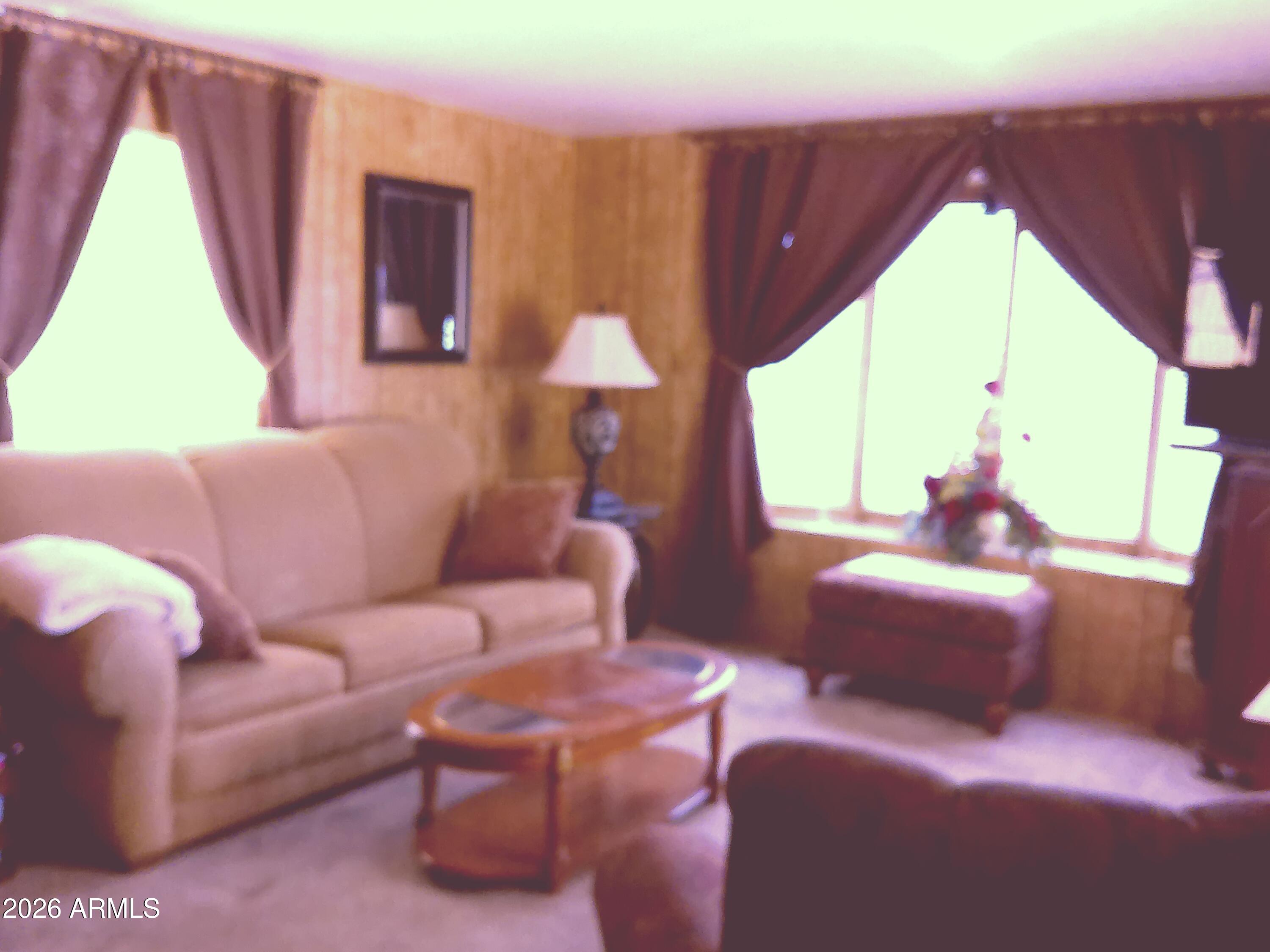 800 West Apache Trail, Unit 142 Apache Junction, AZ 85120 - Photo 8 of 33 a living room with furniture and a large window