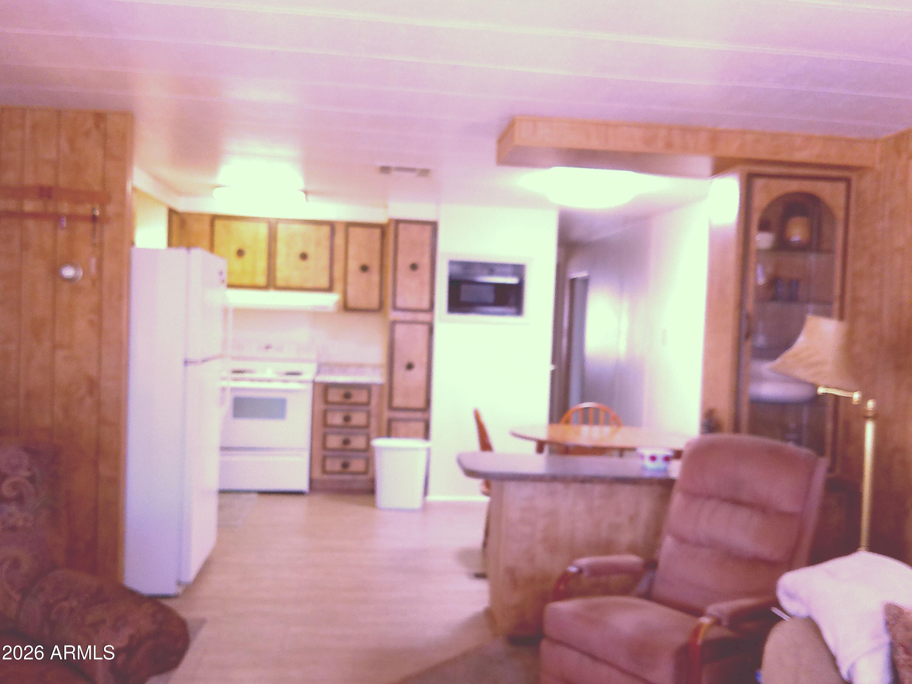 800 West Apache Trail, Unit 142 Apache Junction, AZ 85120 - Photo 10 of 33 a living room with furniture and a refrigerator